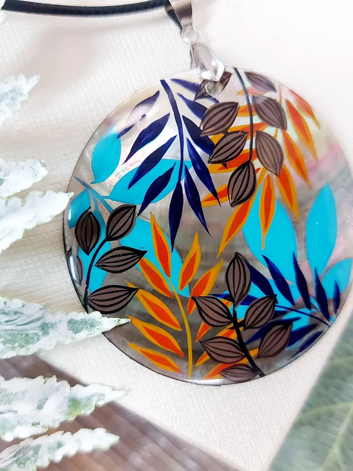 Artistic Expression in Nacre: Abstract Botanical Hand-Painted Mother-of-Pearl Pendant - Captivating Blue and Orange Leaf Motif