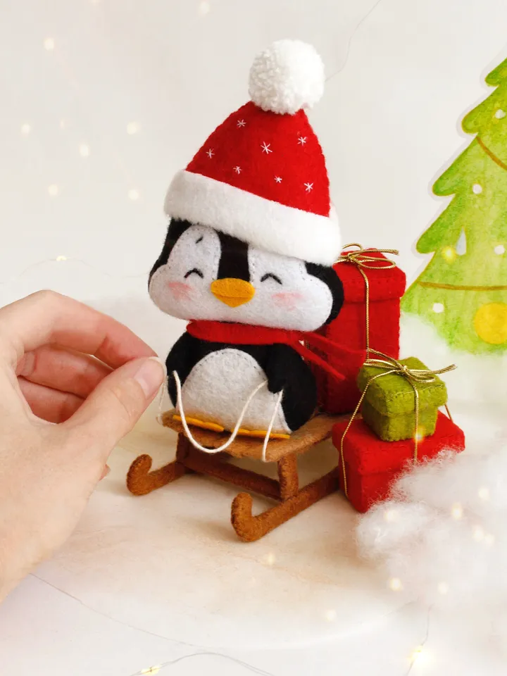 Felt penguin on the sleigh with Christmas presents hand sewing PDF tutorial with patterns, DIY Christmas tree ornament. Soft toy pattern
