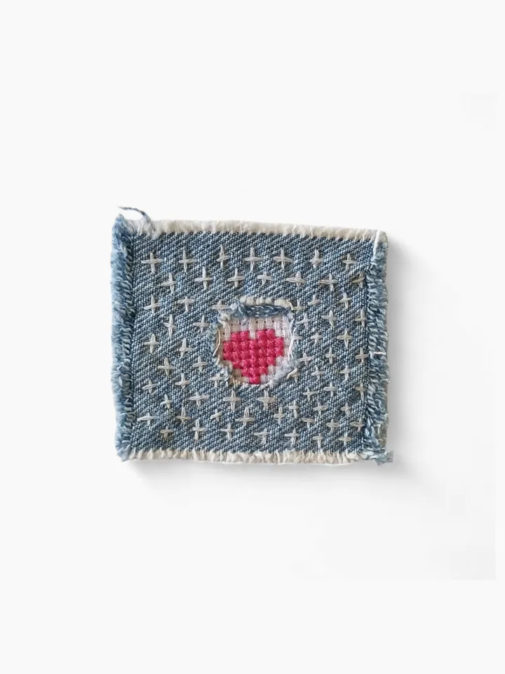 Upcycled denim boro patch. Sashiko stitching.