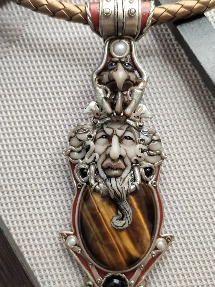 Necklace Shaman on a leather cord. Central cabochon natural tiger eye stone.