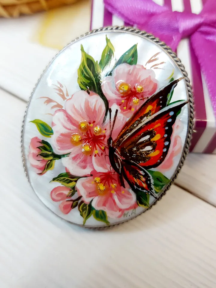 Brooches for women: A delicate butterfly on wild rose blossoms mother of pearl pin, hand painted pink floral brooch made from shell