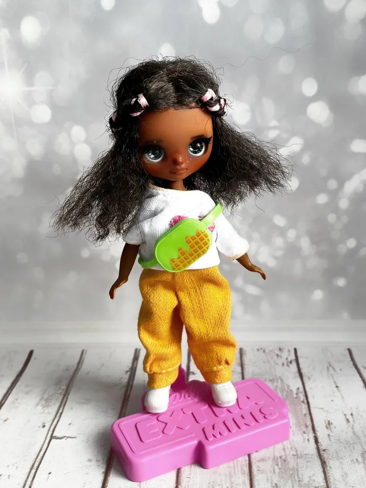 Petite Blythe with dark skin. Adorable miniature doll on an articulated body.
