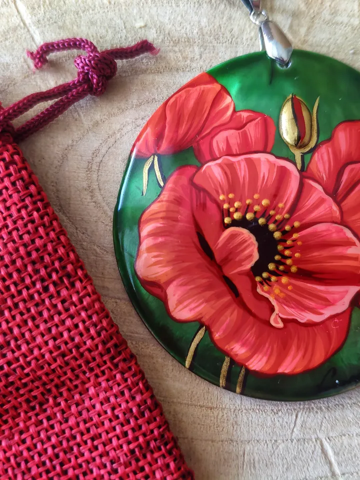 Floral Symphony: Captivating Red Poppy on Iridescent Green Nacre Pendant, a Stunning Blend of Nature and Artistry, Icon of Love and Passion
