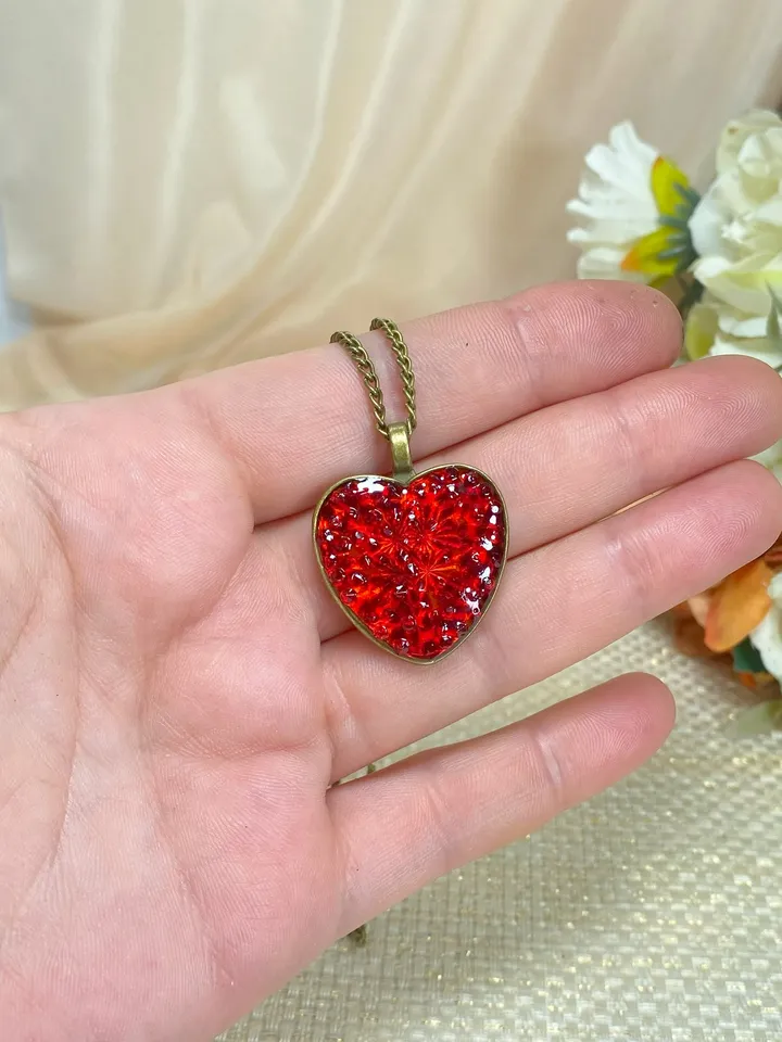 Pendant on a cord. Red heart. Handmade jewelry.3D effect.