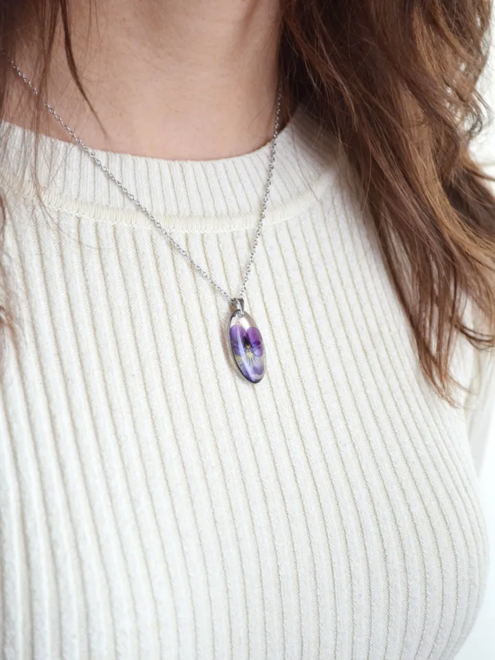 Pendant with a real pansy flower in the resin. Tiny viola flower necklace.