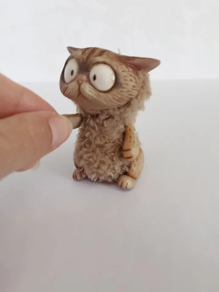 Discouraged cat doll