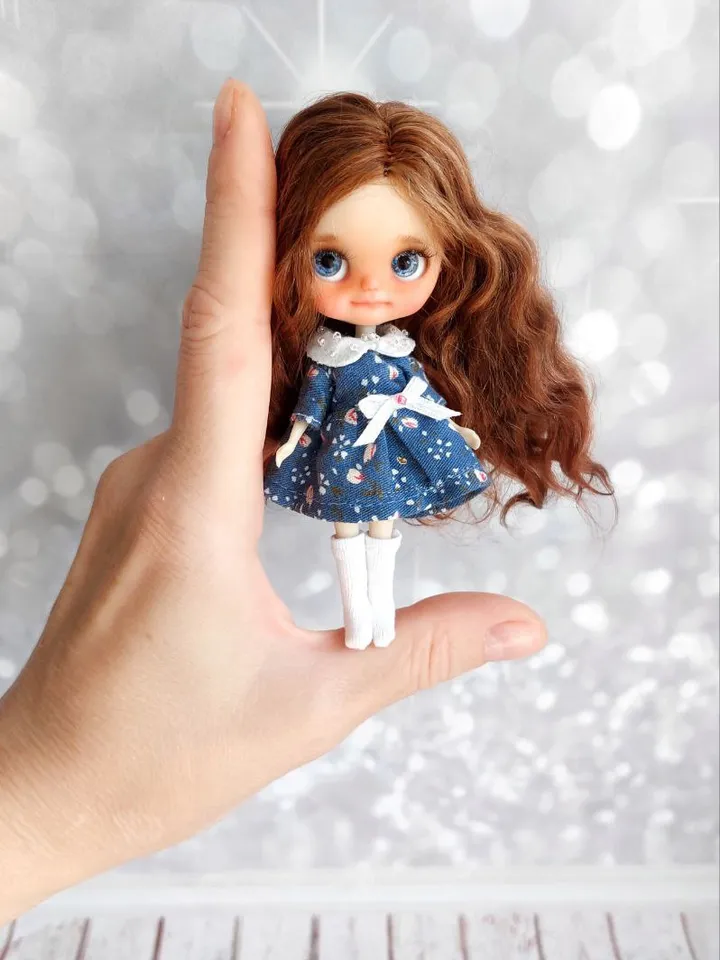 Charming little girl with brown hair and blue eyes. Author's miniature doll for your collection.