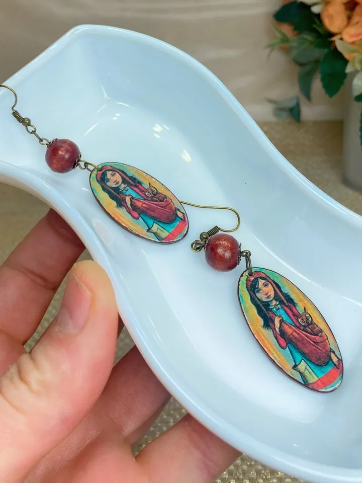Handmade earrings. Author's design. Jewelry.Earrings with a picture of a girl. Wooden earrings.