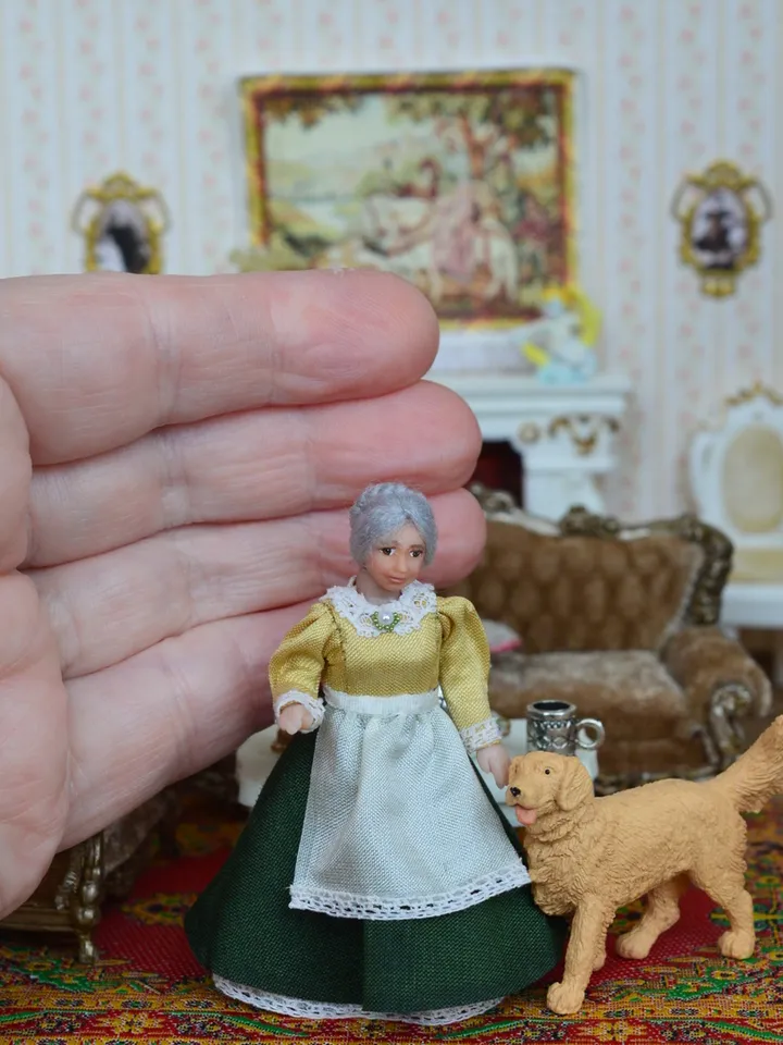 Miniature dolls in 24th scale. A grandmother with a baby for a dollhouse.