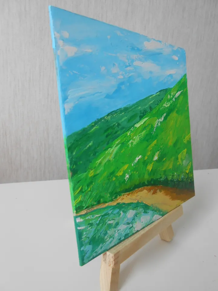 Mountains by the lake. Bright landscape with oil paints.