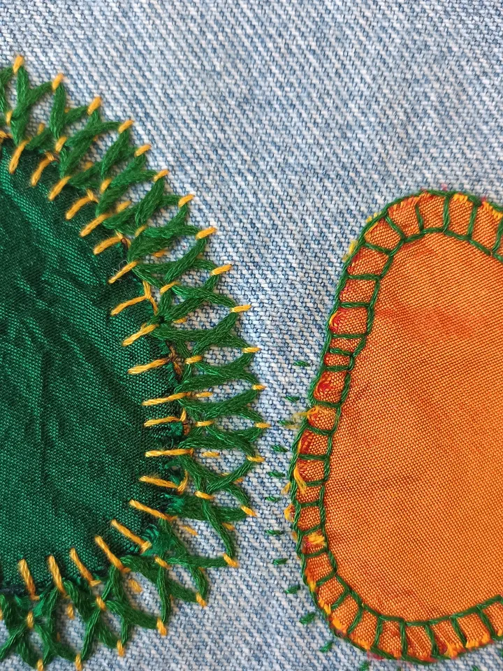 Upcycled denim boro patch – visible mending.