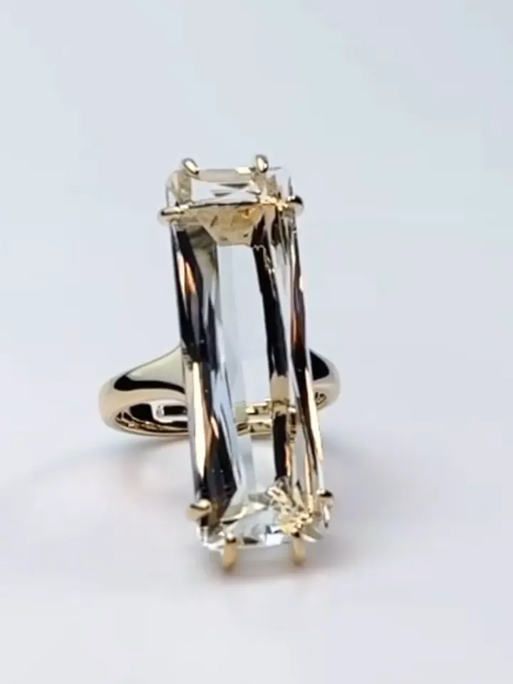 Ring gilded with a large rectangular crystal stone, one-size adjustable 16-20 size