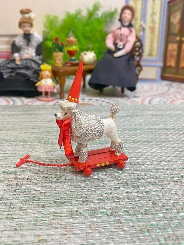 Poodle on a cart. Doll toy. Scale 1:12.