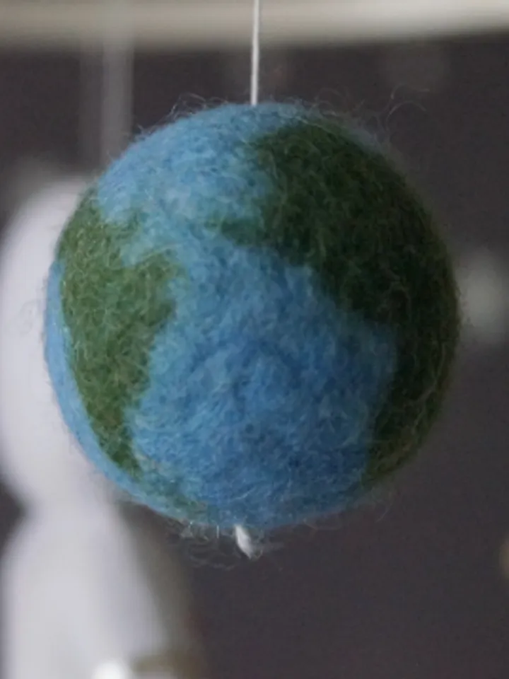A space mobile for astronaut's nursery, a Shuttle and a rocket made of felt for the decor boy's room