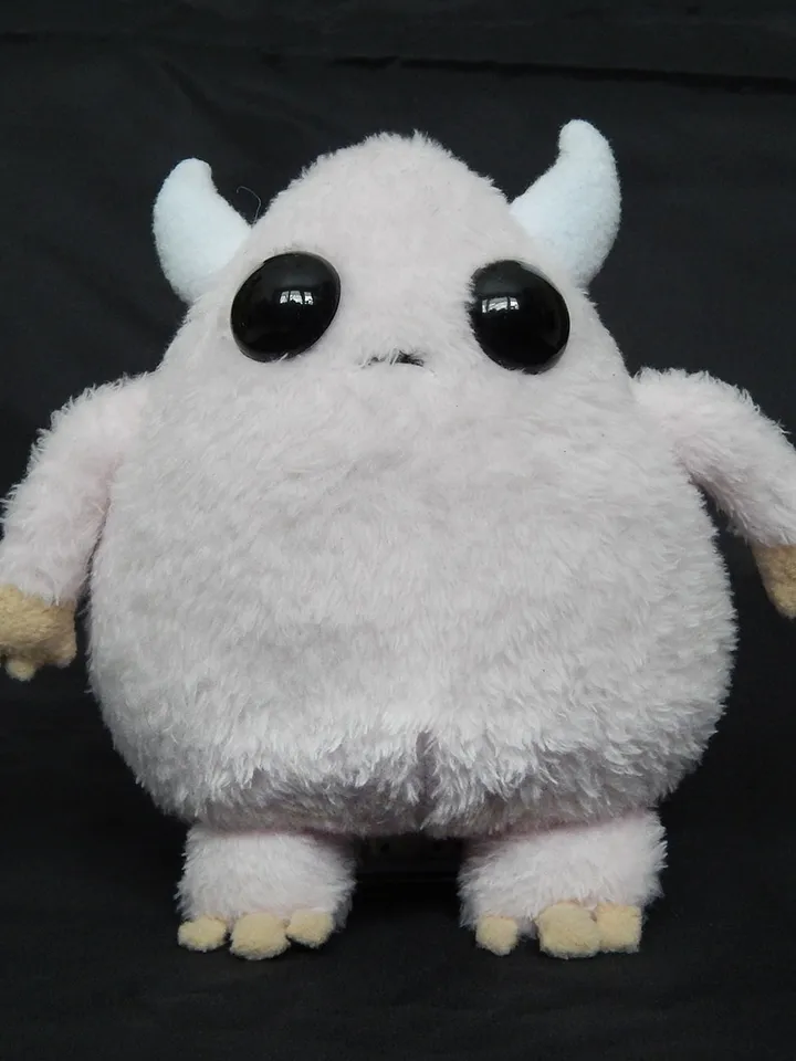 Cute pink fluffy monster toy