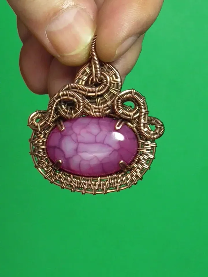Handmade copper wire and stone pendant.