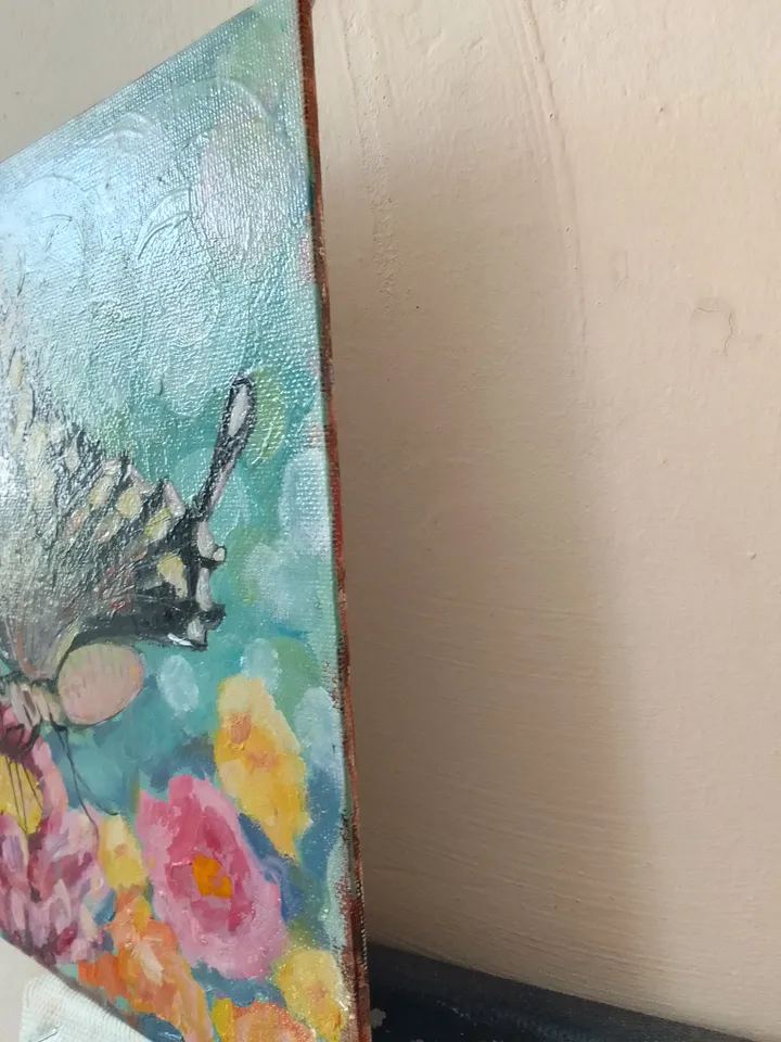 Painting flowers with a butterfly naif art bokeh