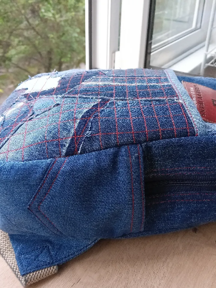 Stylish HANDMADE denim BACKPACK WITH a DEEP POCKET IN THE FRONT IN the lazy boro Patchwork STYLE and lined with red plai