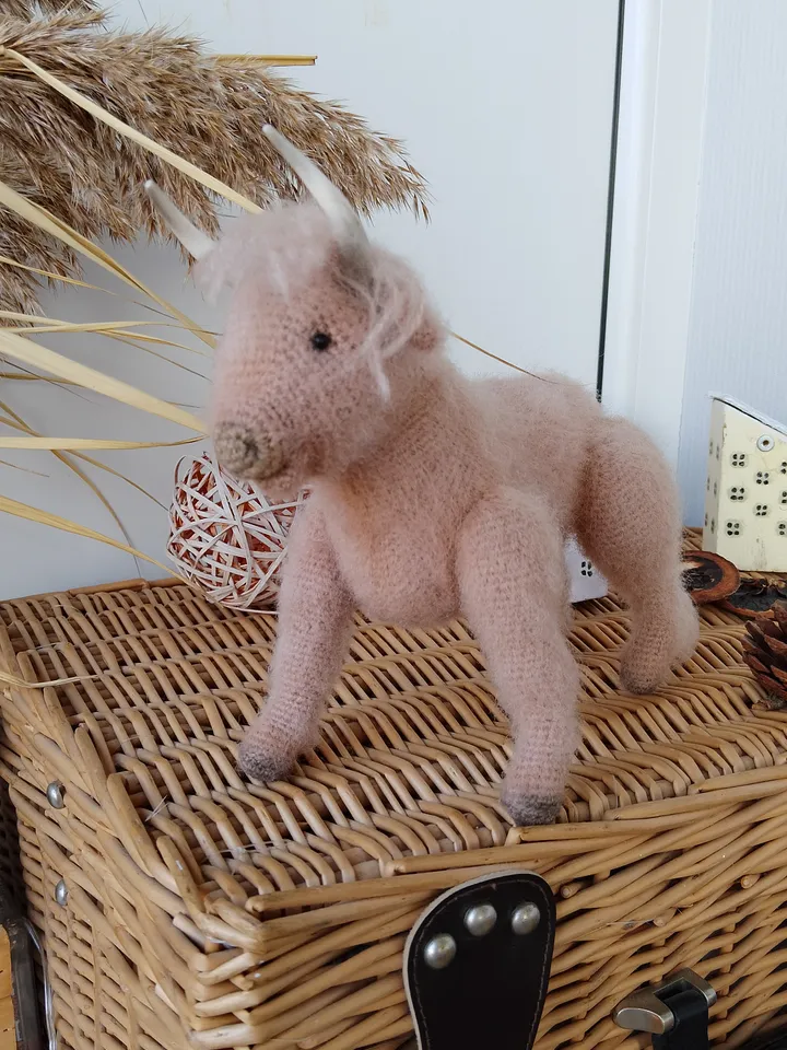 Naturalistic handcrafted bull figure with decorative elements. Stuffed cow Collectible model specimen bull toy