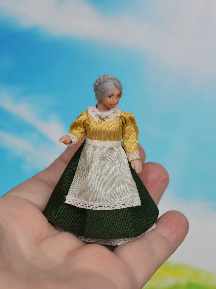 Miniature dolls in 24th scale. A grandmother with a baby for a dollhouse.