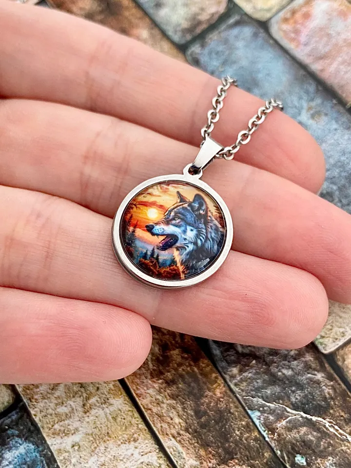 Wolf at sunset, steel pendant with glass