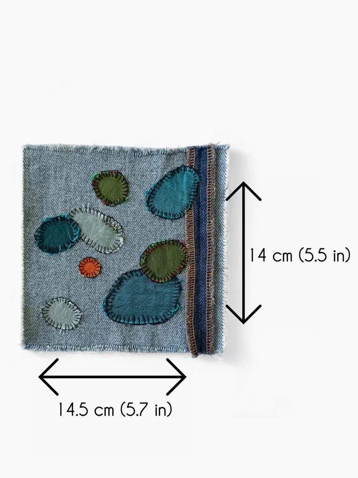 Upcycled denim/silk boro patch – visible mending.