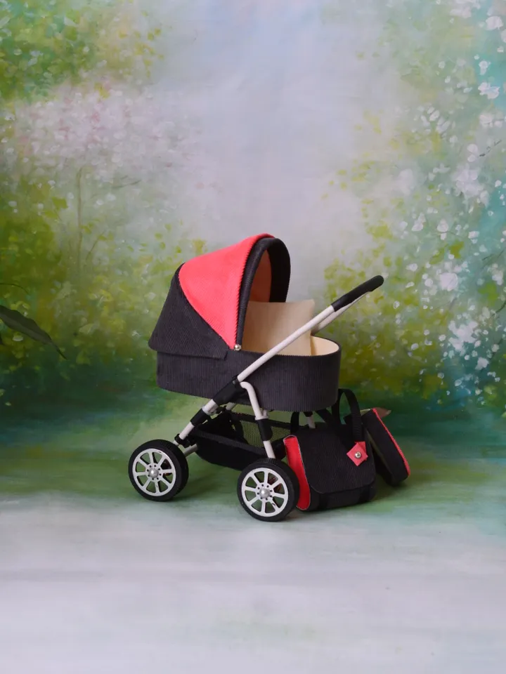 Miniature toy stroller for Barbie dolls.