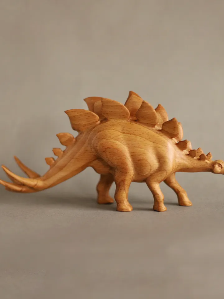 Wooden hand carved dinosaur stegosaurus