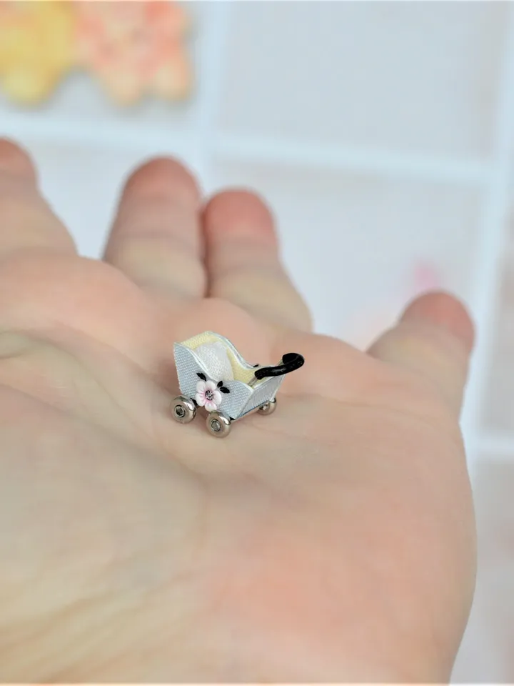 Miniature doll stroller. 1:48 scale. Dollhouse toy. Baby stroller.