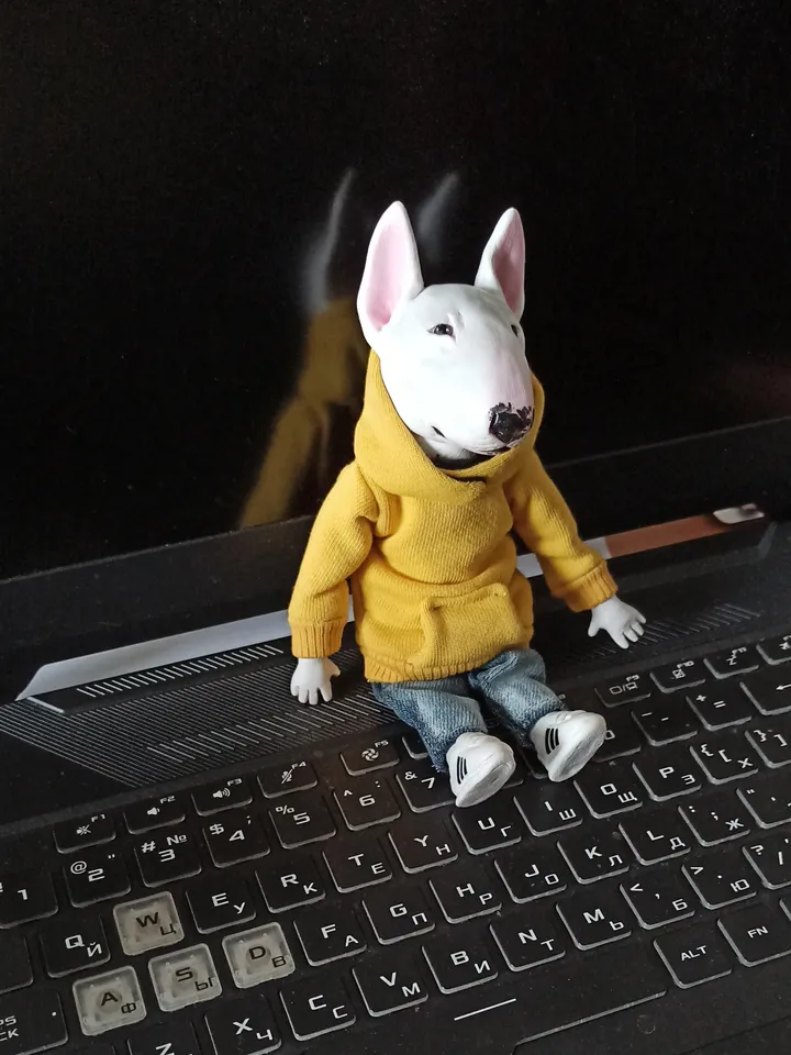 Bull Terrier doll in a yellow sweater