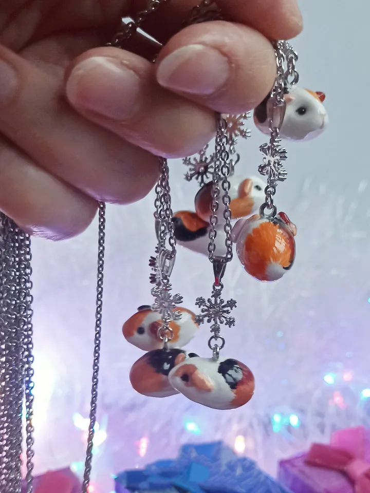 a Handmade guinea pig necklace rundom color  (pre-order)