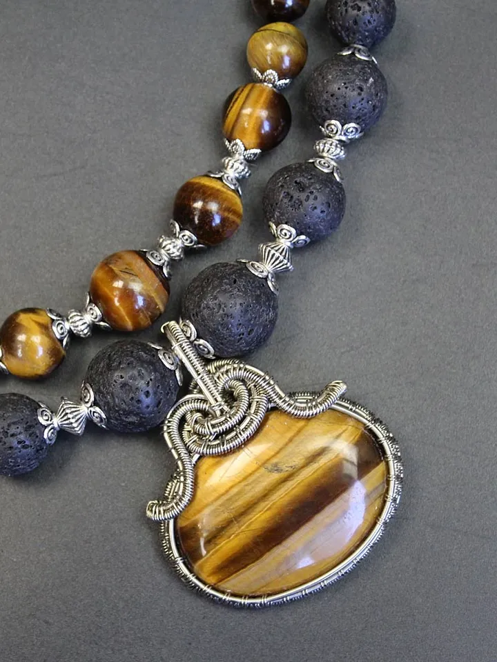 Necklace made of natural stones volcanic lava and tiger eye.