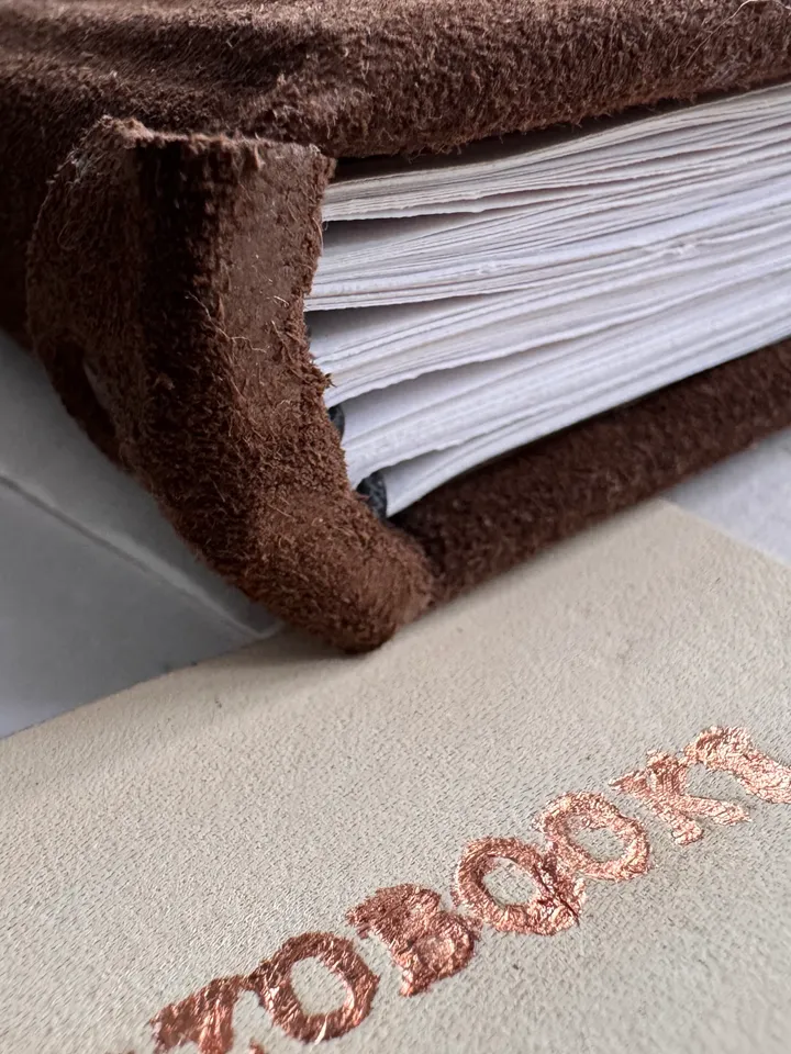 Notebook made of genuine suede with leather insert and wood engraving.