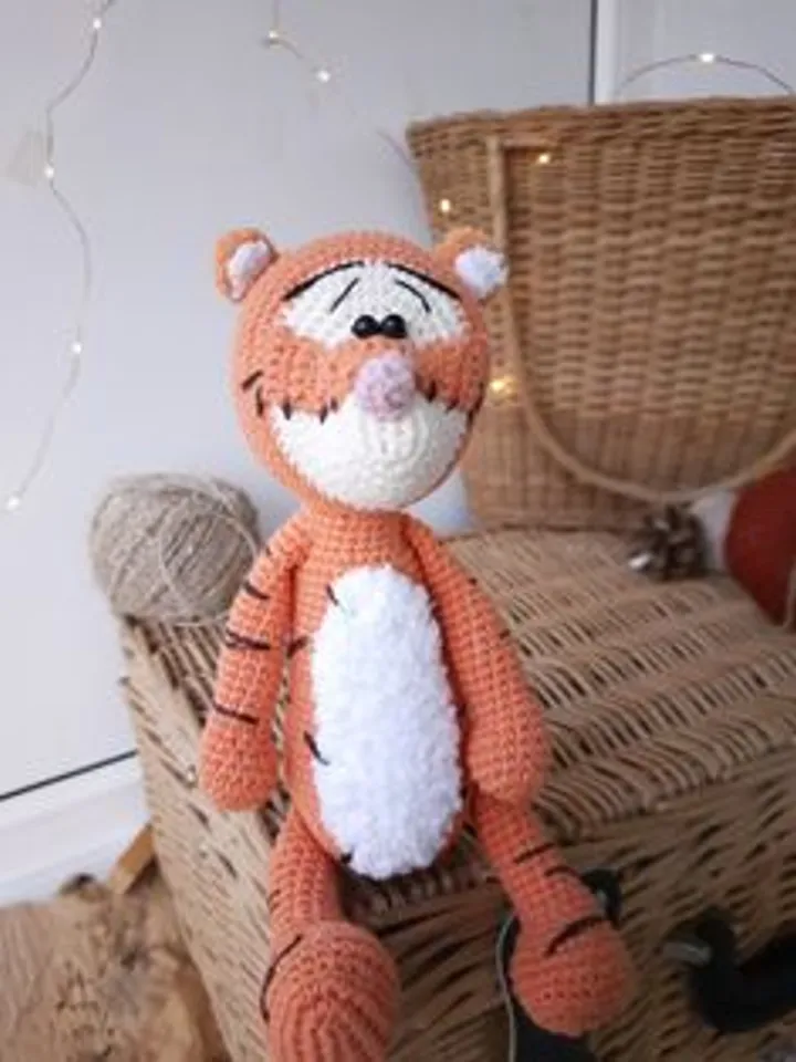 Orange tiger cub Disney cartoon character. Stuffed animal tiger soft toy
