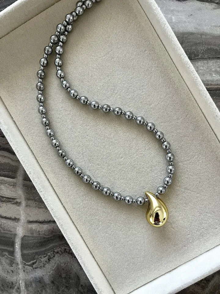 Hematite necklace with gold drop