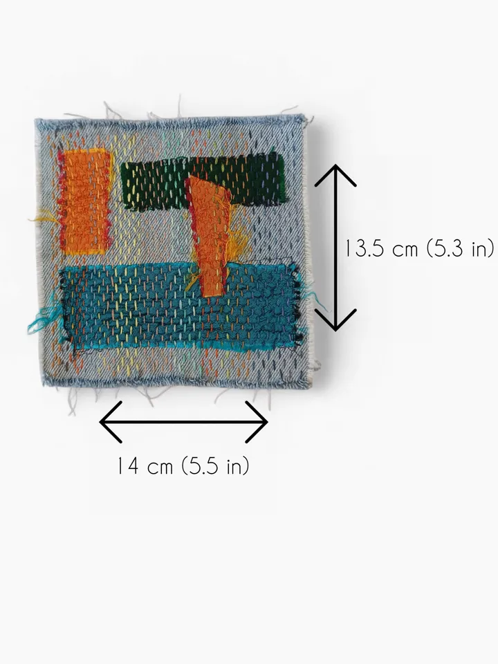 Upcycled denim boro patch – visible mending.