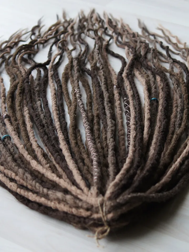 Wavy Synthetic Dreadlock Extensions in Ash Brown with Boho Beads and Wraps for Natural Looking Festival Hairstyles