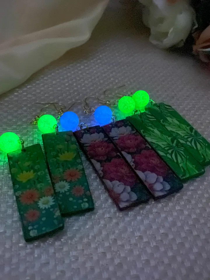 Earrings with luminous beads. Handmade jewelry.