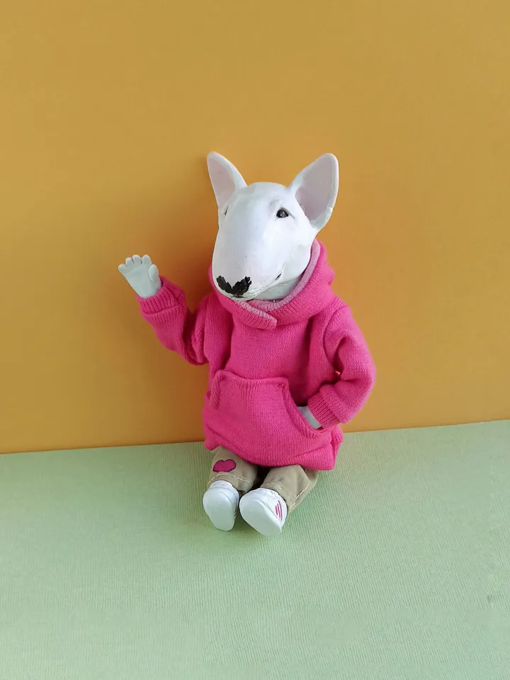 Bull Terrier doll in a pink sweater
