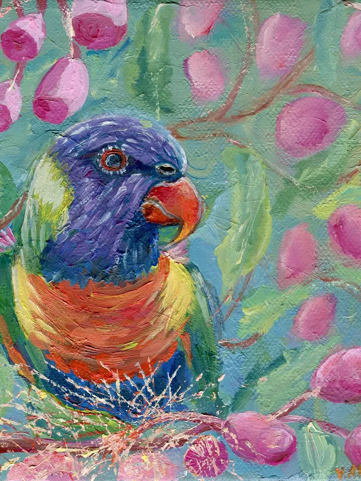 Parrot sits on a branch of a flowering tree