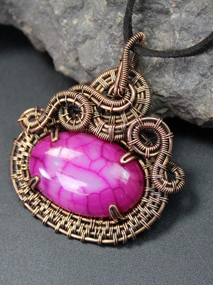 Handmade copper wire and stone pendant.