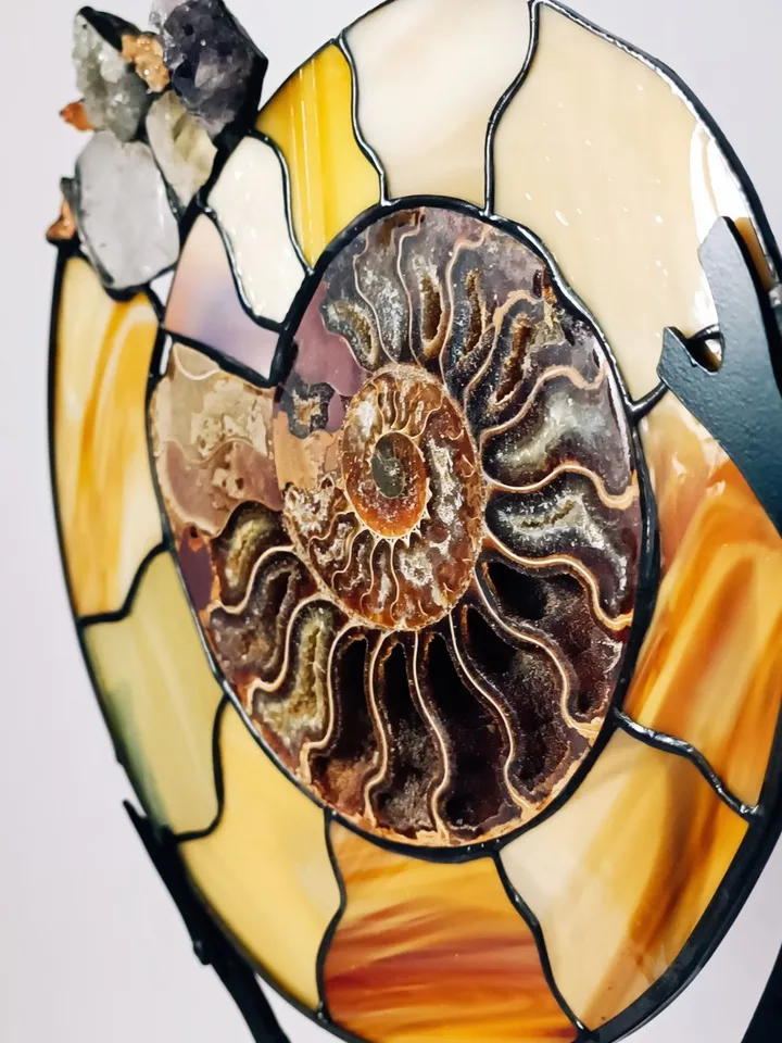 Tiffany Stained Glass: Ammonite with Gemstones on a Branch Stand, Artistic Ammonite with Gemstones in Tiffany Style, Ammonite Fossil with Crystals on a Sculptural Stand, Unique Ammonite Stained Glass Art with Gemstones, Decorative Ammonite with Gemstones