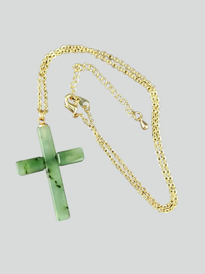 Christian cross pendant green jade on a gold plated chain.