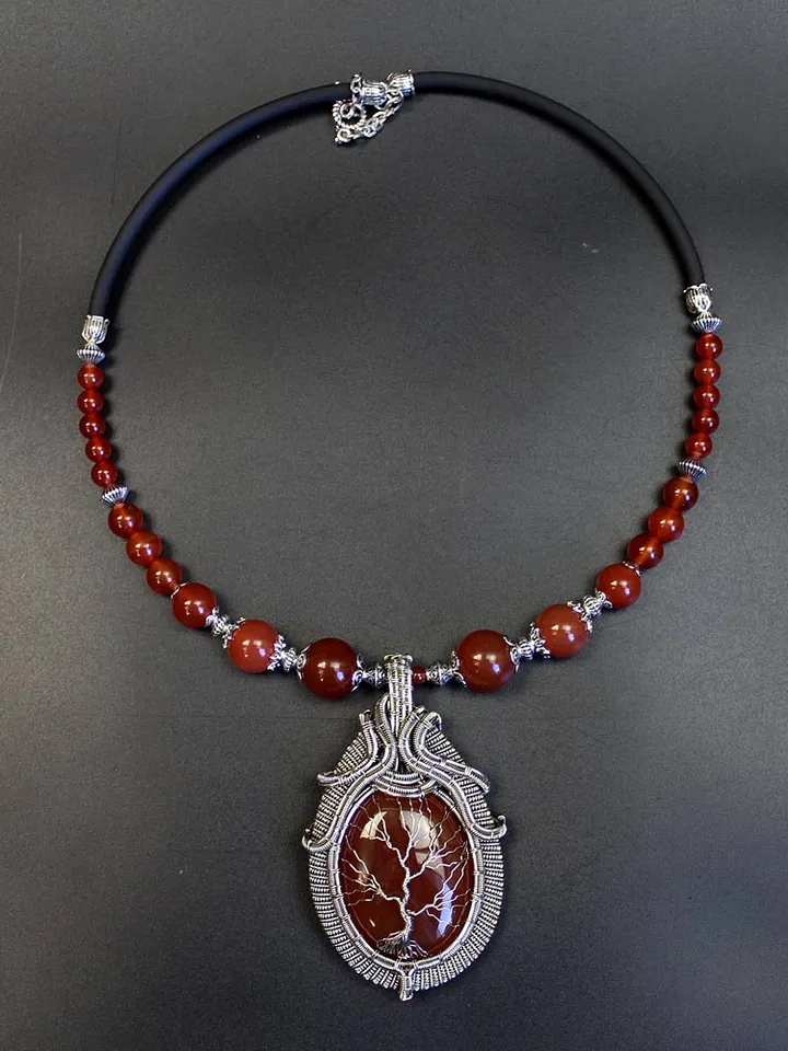The Tree of Life necklace is handmade with natural birthstones.
