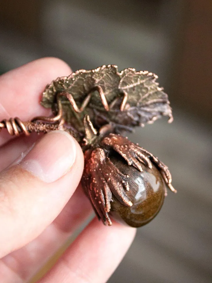 Unique handmade electroformed pendant made of natural leaves and twigs with natural tiger eye stone