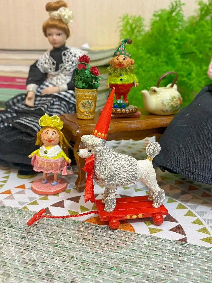 Poodle on a cart. Doll toy. Scale 1:12.