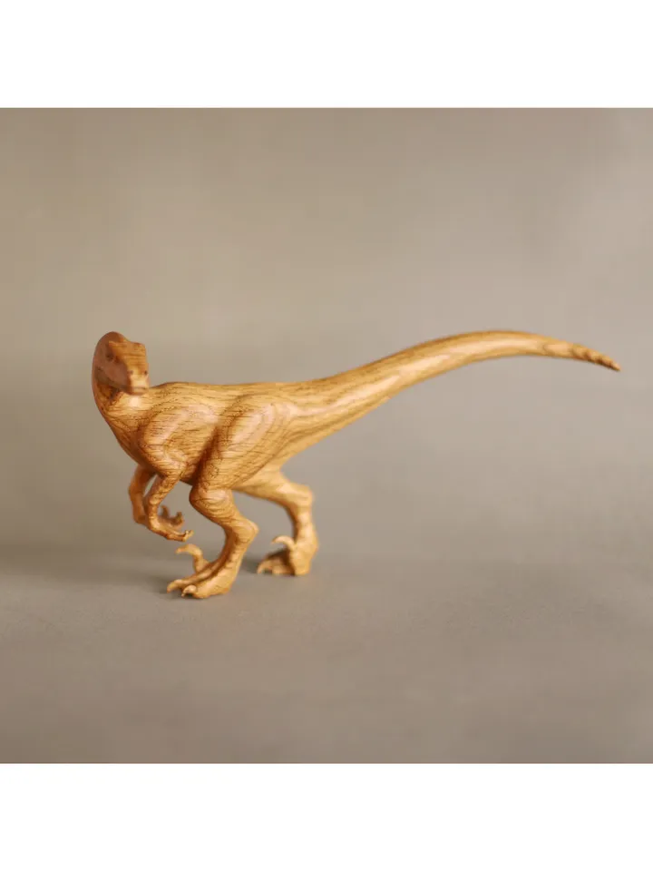 Wooden hand carved dinosaur velociraptor