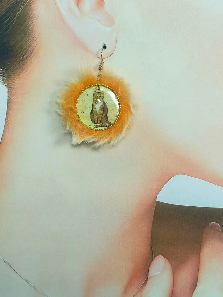 Cute handmade earrings. Image of cats, fur trim.