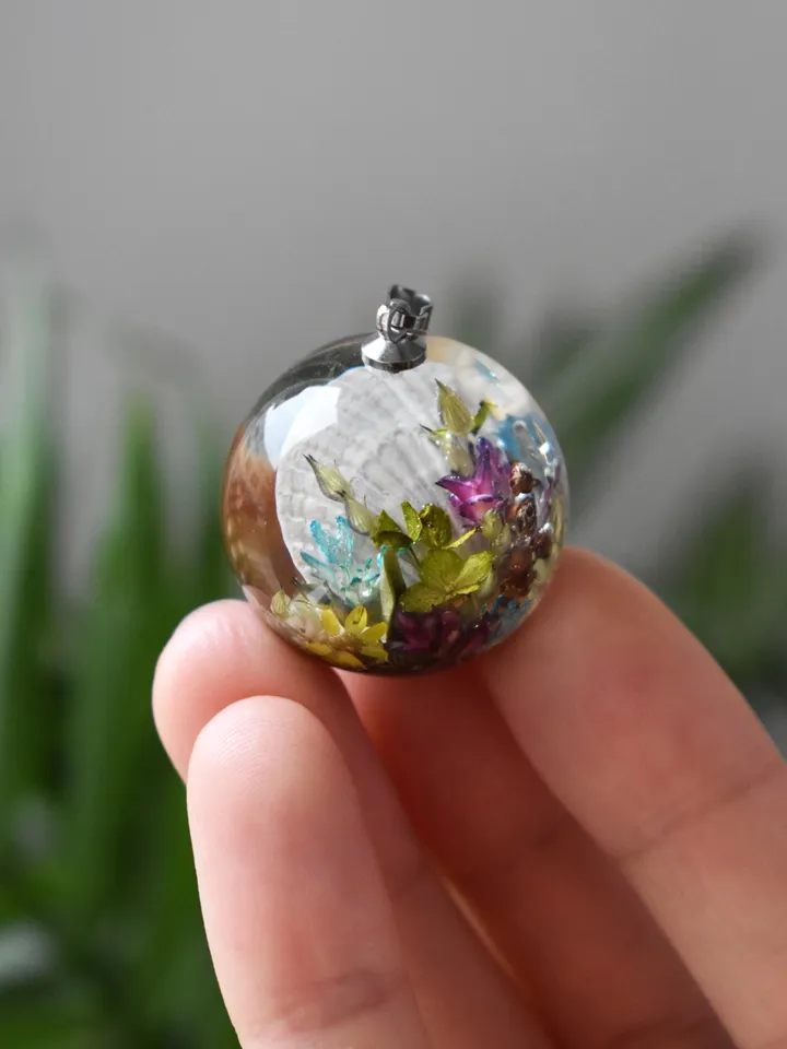 Shell with a pearl pendant. Sea pendant with shell, pearl and real flowers. Pinctada pendant.