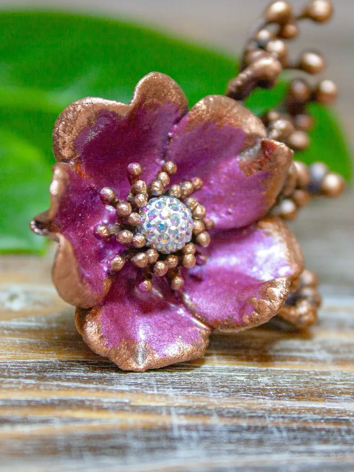 Unique handmade copper ring made from a real flower bud using the electroforming method, decorated with a Swarovski crystal